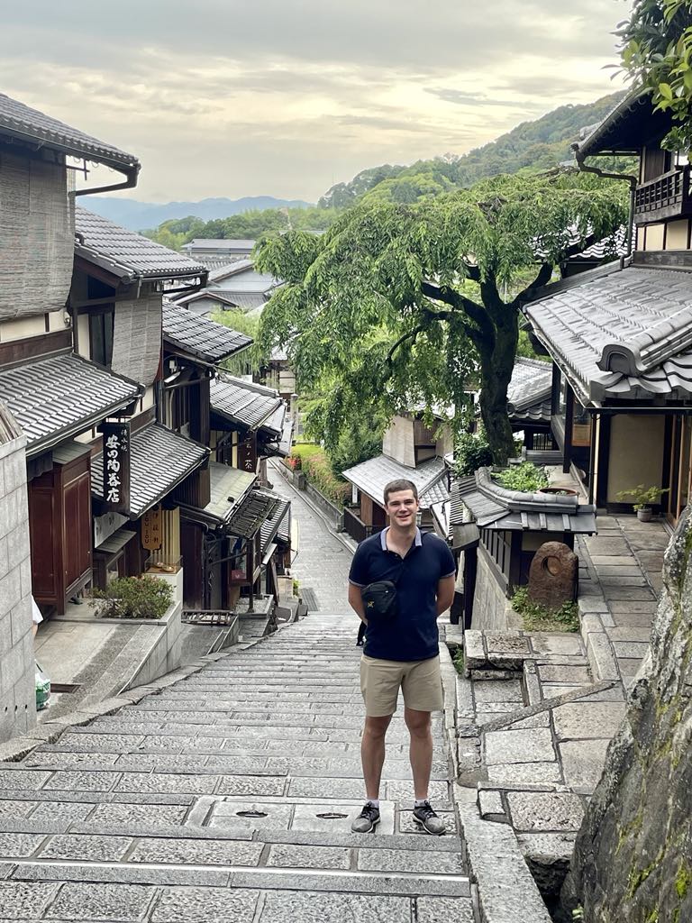 AWS Senior Solutions Architect, Michael Mumma standing in cobblestone street.