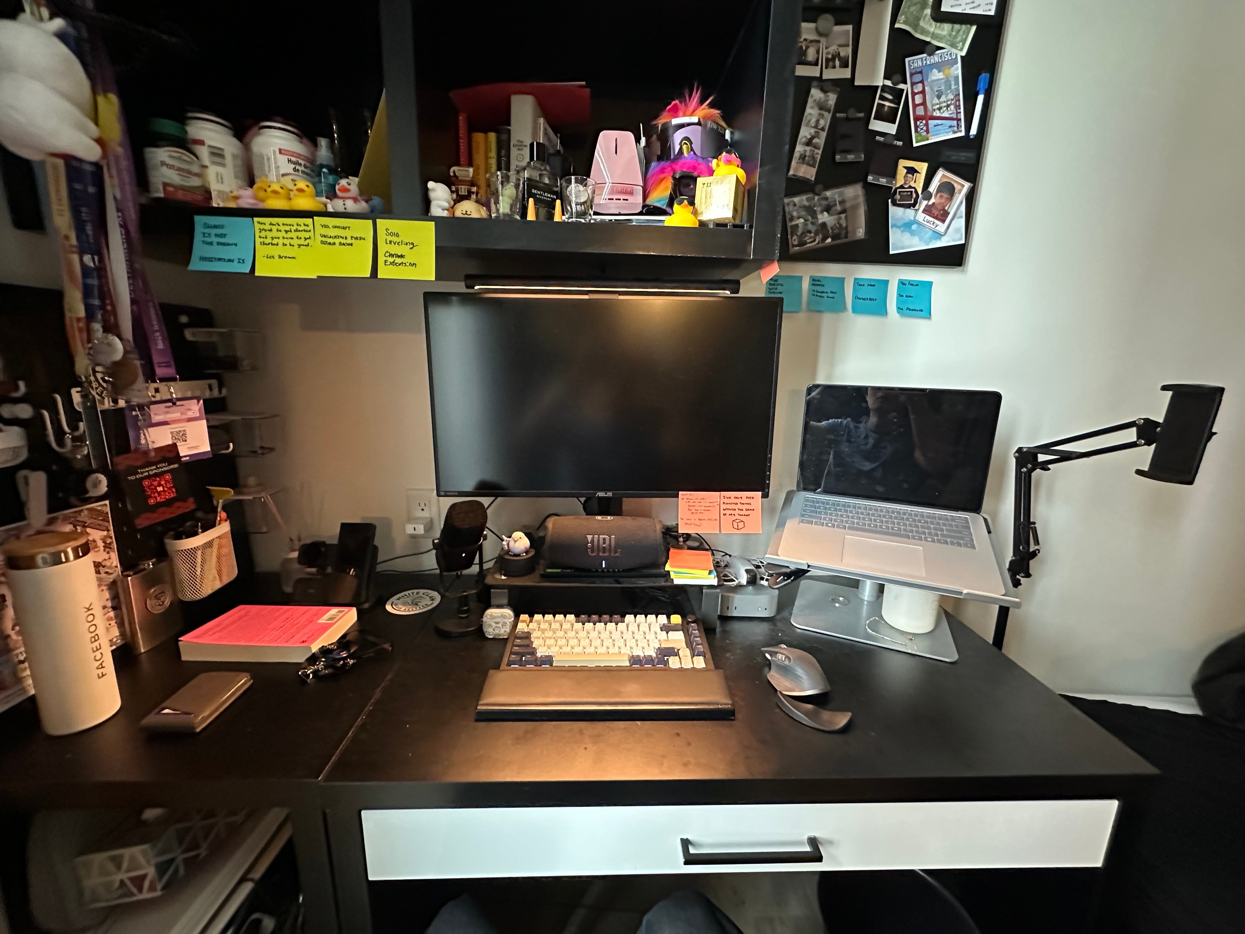 James Yang's desk setup with multiple monitors, a laptop, and a HHKB keyboard.