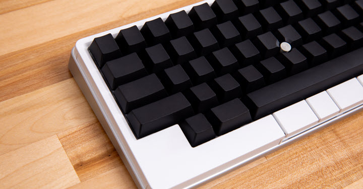 White HHKB keyboard with black keys. 