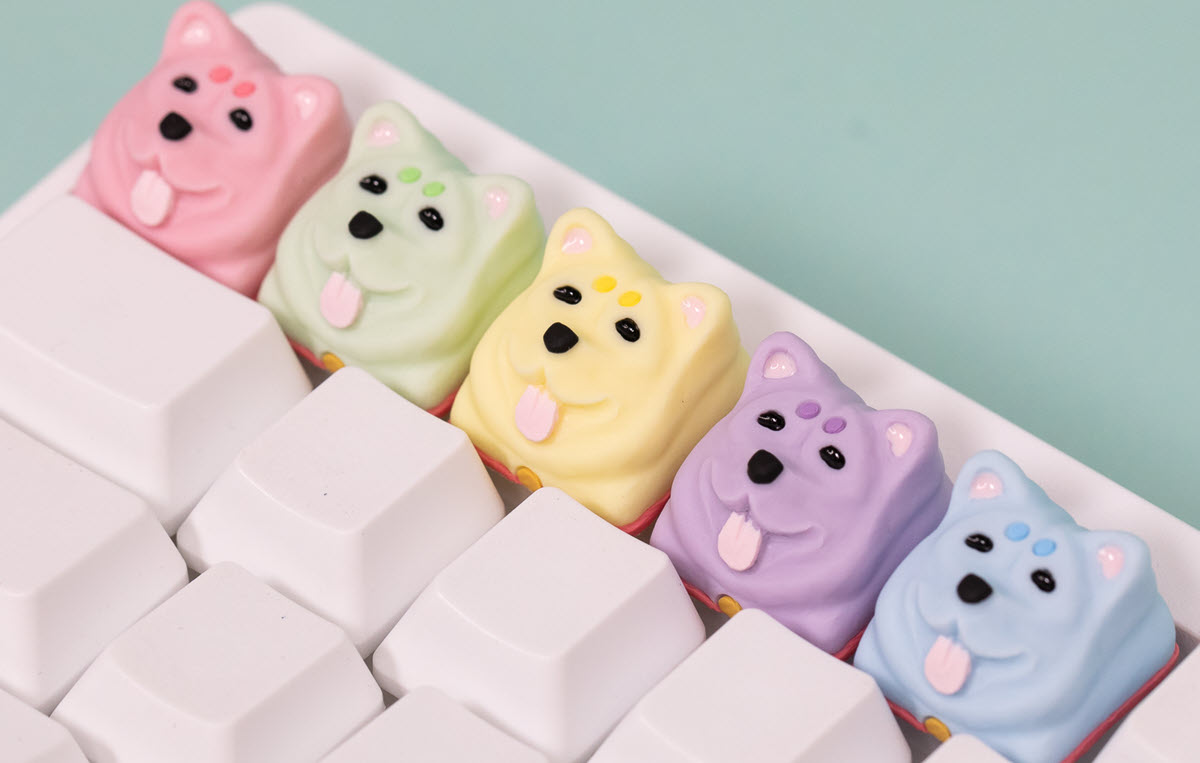 The entire 5 option colorway of Keynu artisan keycaps with a hand-sculpted Shiba Inu design by Amano Studios for HHKB keyboards.